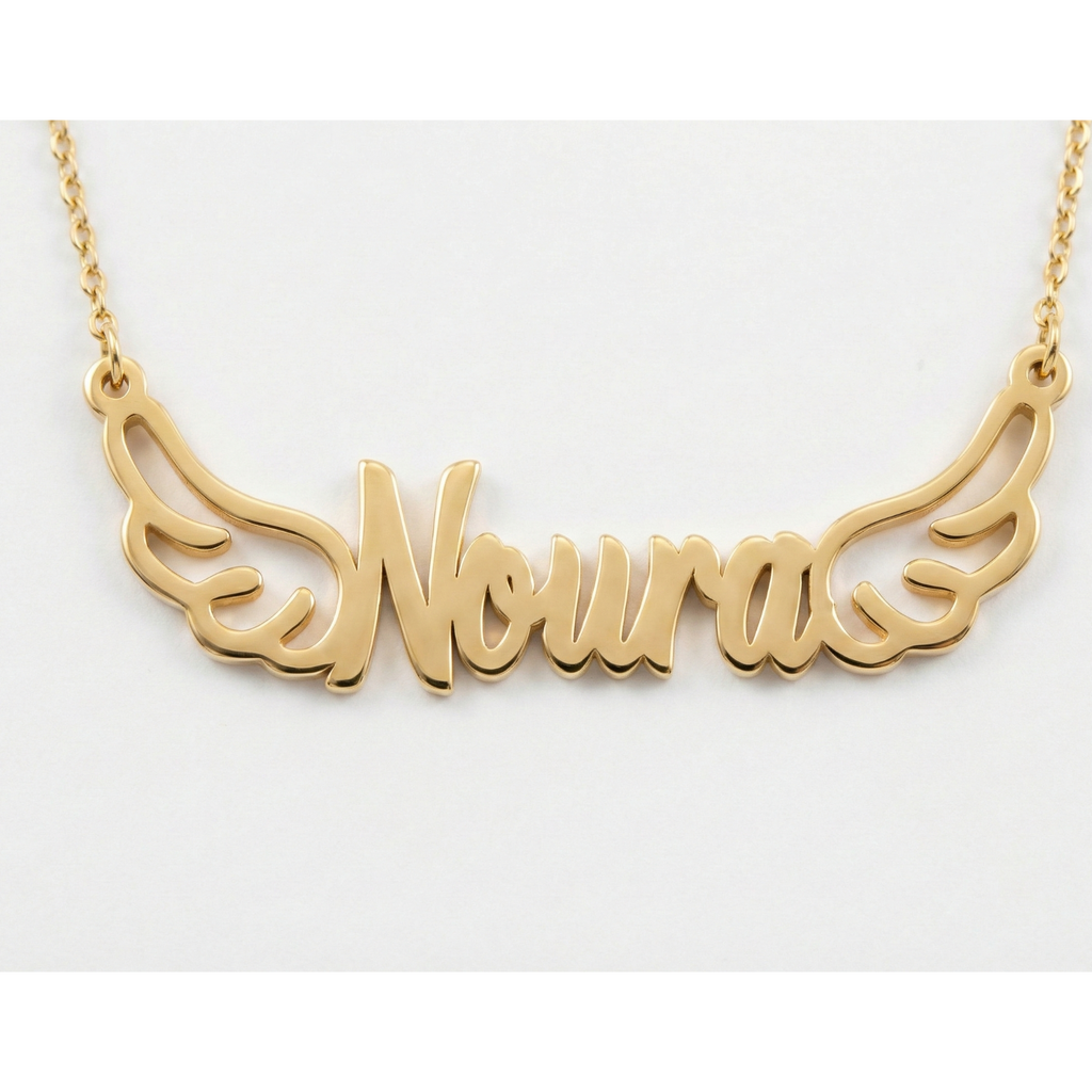 Gold necklace with 'Noura' written on it against a white background