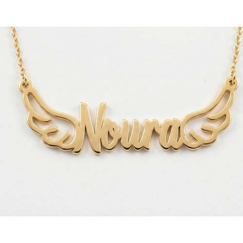 Gold necklace with 'Noura' written on it against a white background